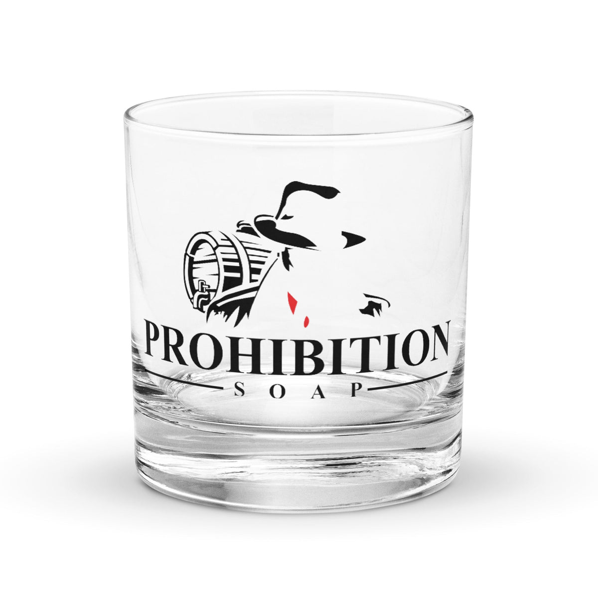 Clear glass tumbler with black logo and orange band, black PROHIBITION SOAP lettering