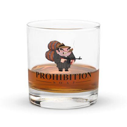 Clear glass tumbler with cartoon character, black PROHIBITION SOAP lettering, orange band