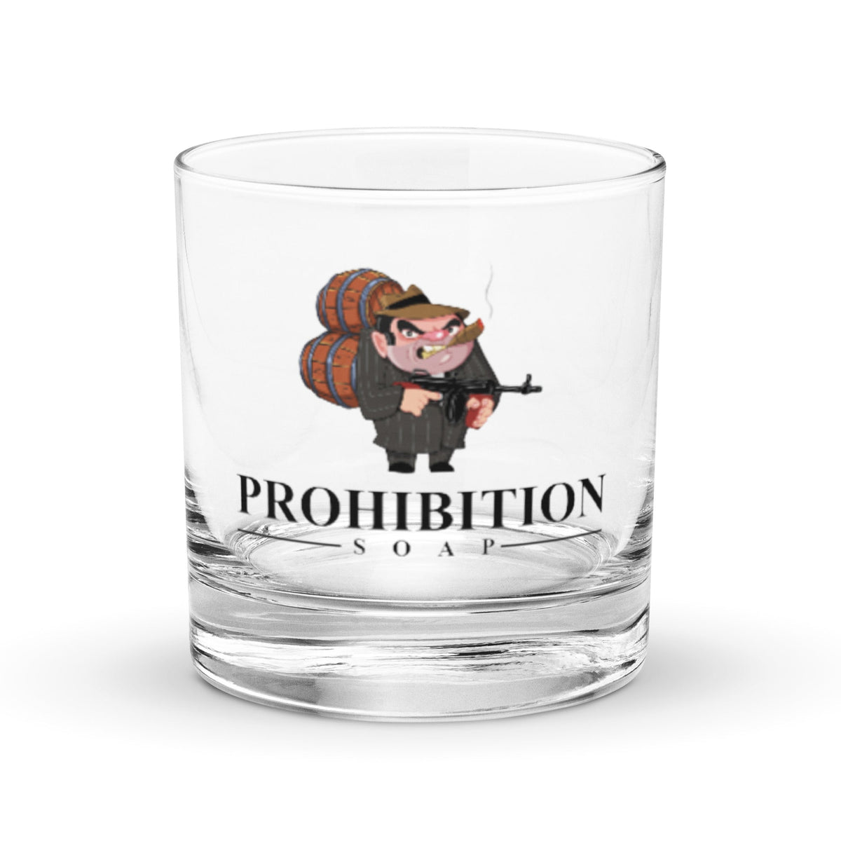 Clear glass tumbler with cartoon character graphic and black PROHIBITION SOAP lettering