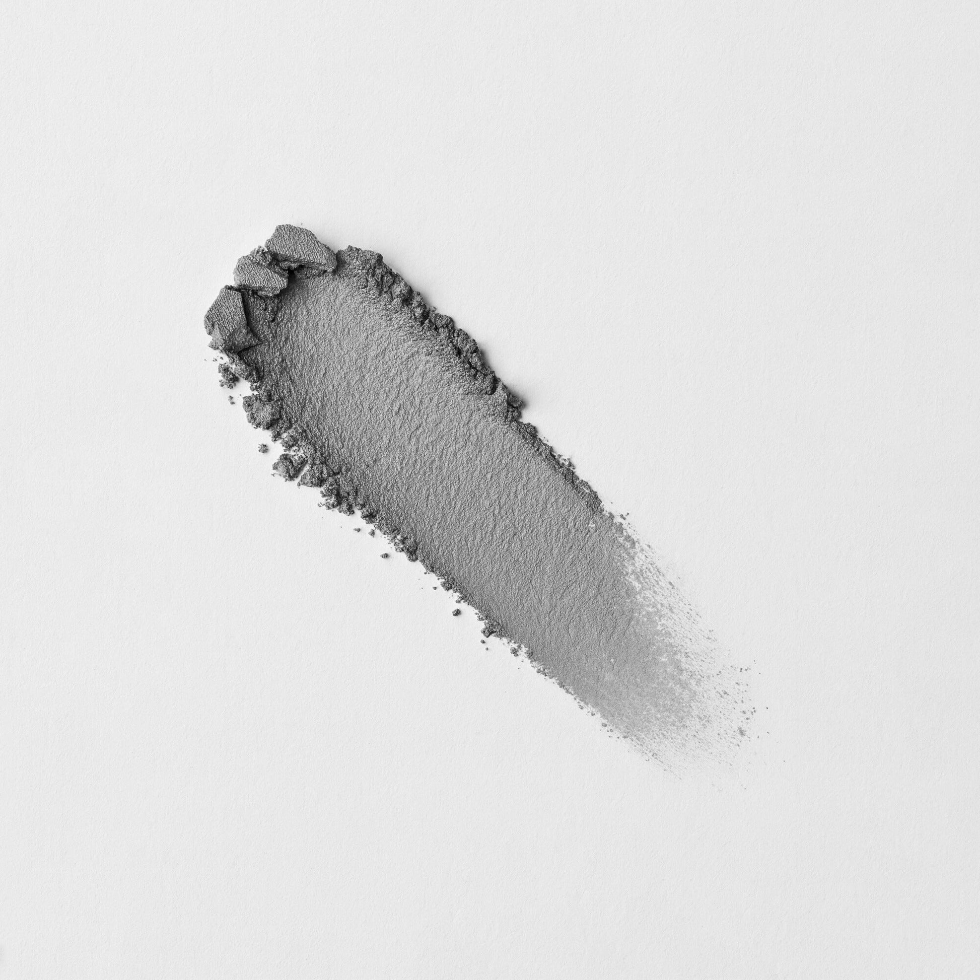 Pressed eyeshadow swatch, charcoal gray metallic with fallout