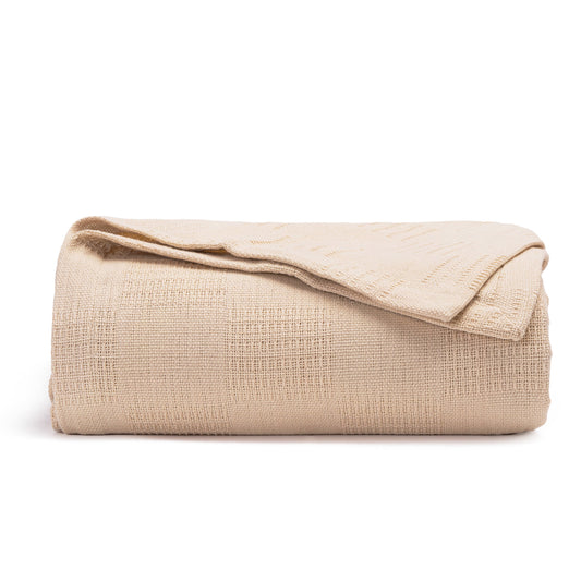 Queen lightweight cotton blanket, folded beige textured weave, neatly rolled edges