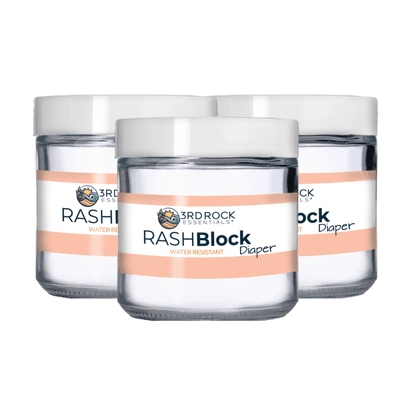 Three RASHBlock water-resistant diaper gel jars with silver lids and orange labels