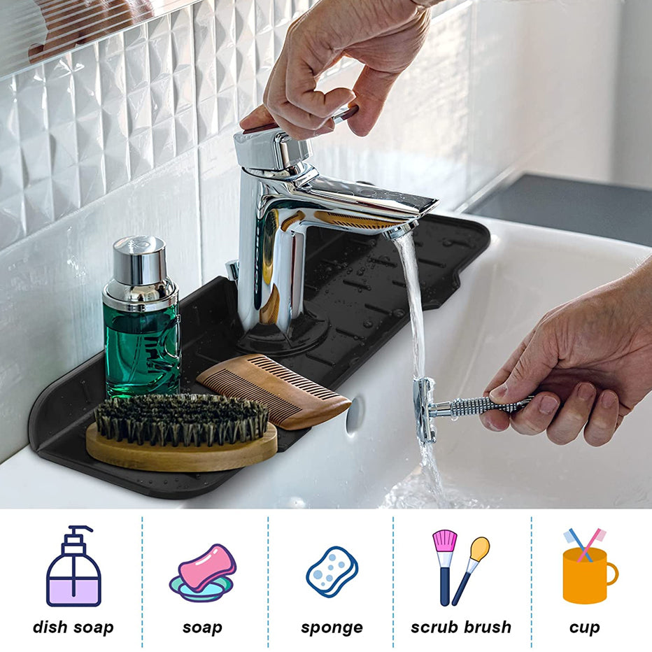 Black kitchen faucet mat tray with raised drain texture next to faucet
