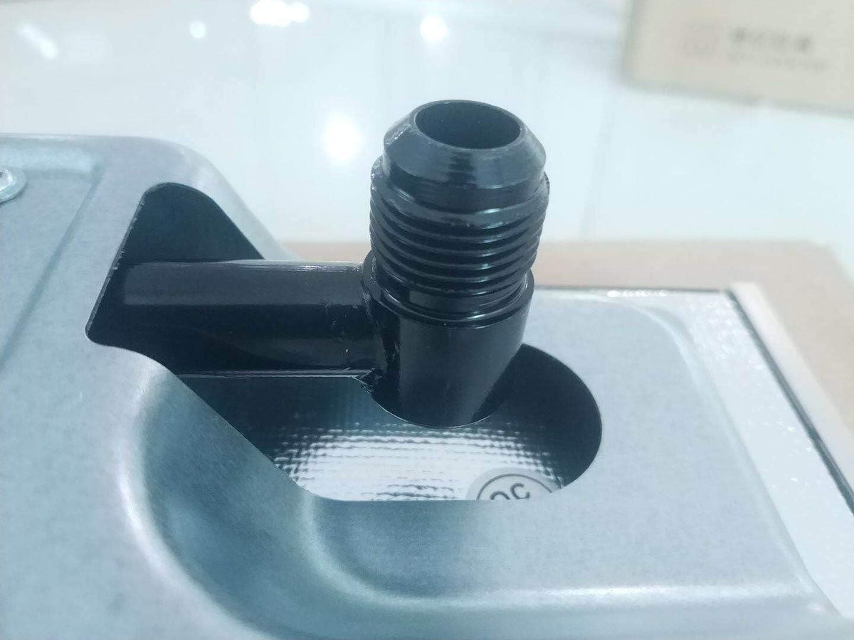 Black gas cooktop valve outlet connection on the burner base