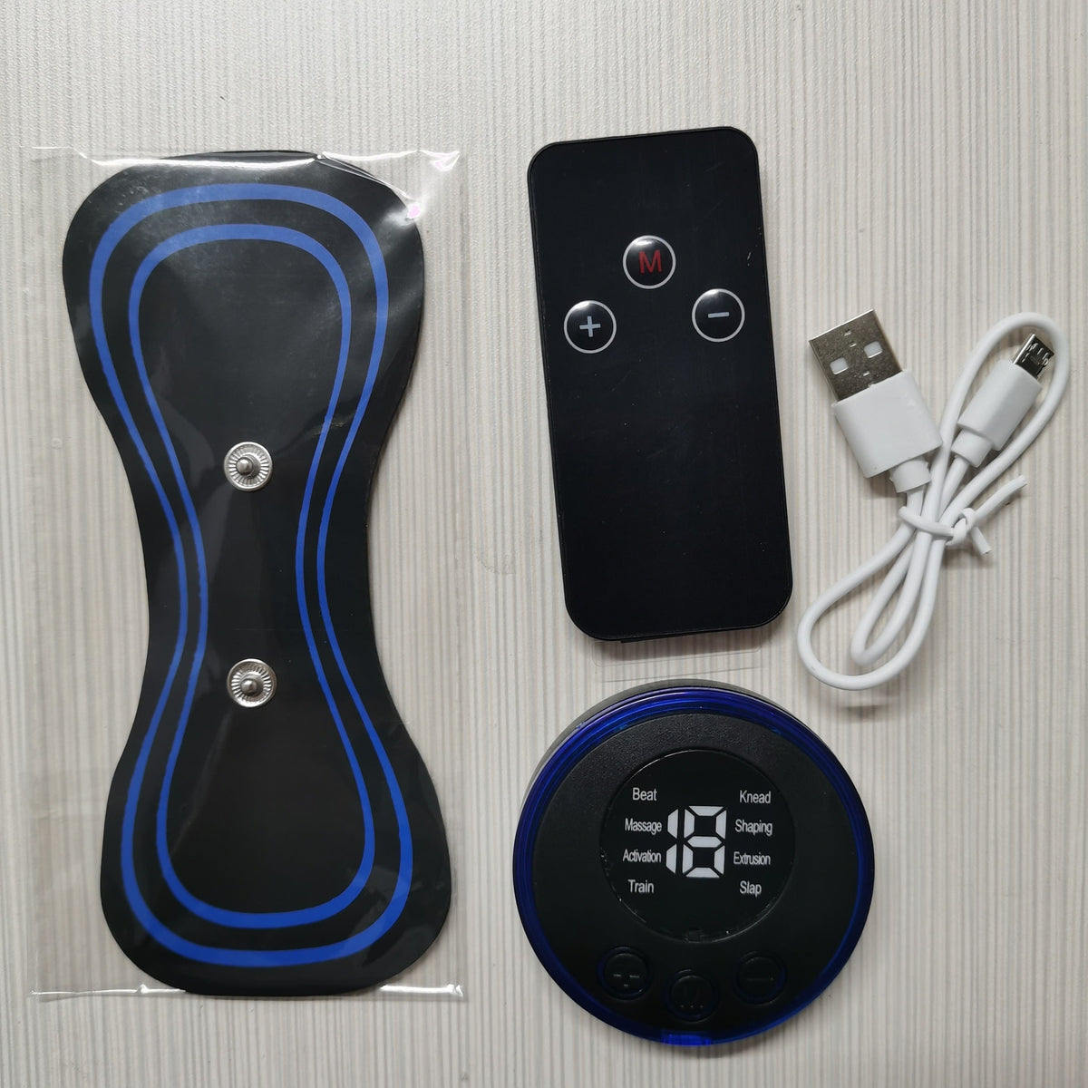 Neck EMS pulse massager accessories set with controller, remote, pads, and USB cable