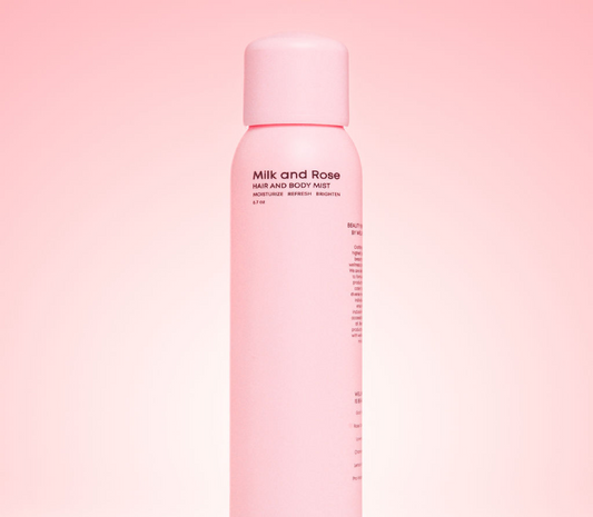 Body mist bottle, pink with cap, label shows Milk and Rose hair and body mist