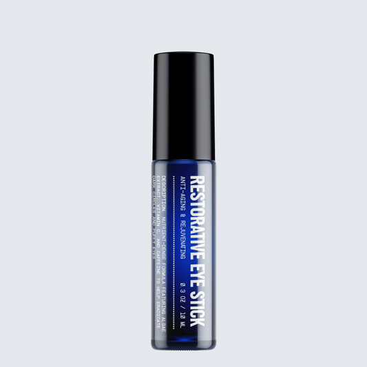 Restorative eye stick, blue cap and clear blue tube with printed label