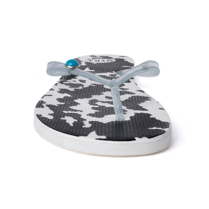 Cowhide slippers with cow print upper and light blue straps; cushioned sole