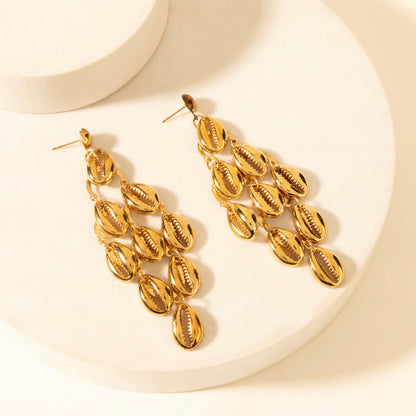 Gold shell-style drop earrings with multiple stacked leaf-like charms