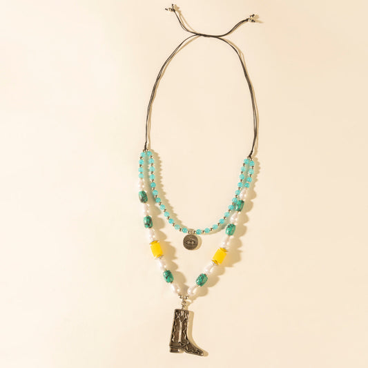 Layered turquoise bead necklace with cowboy boot pendant and coin charm