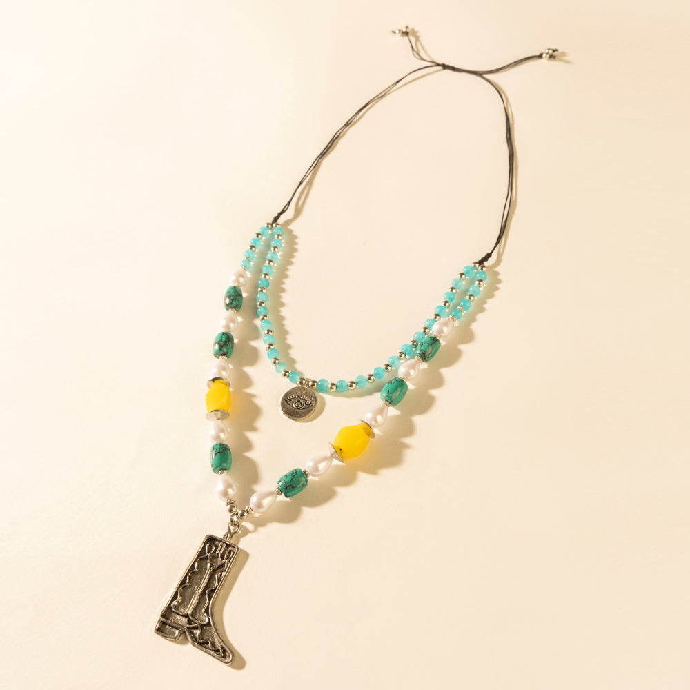 Layered turquoise bead necklace with cowboy boot pendant and dangling bead fringe