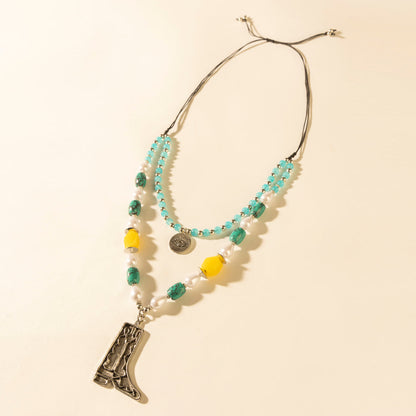 Layered turquoise bead necklace with cowboy boot pendant and dangling bead fringe