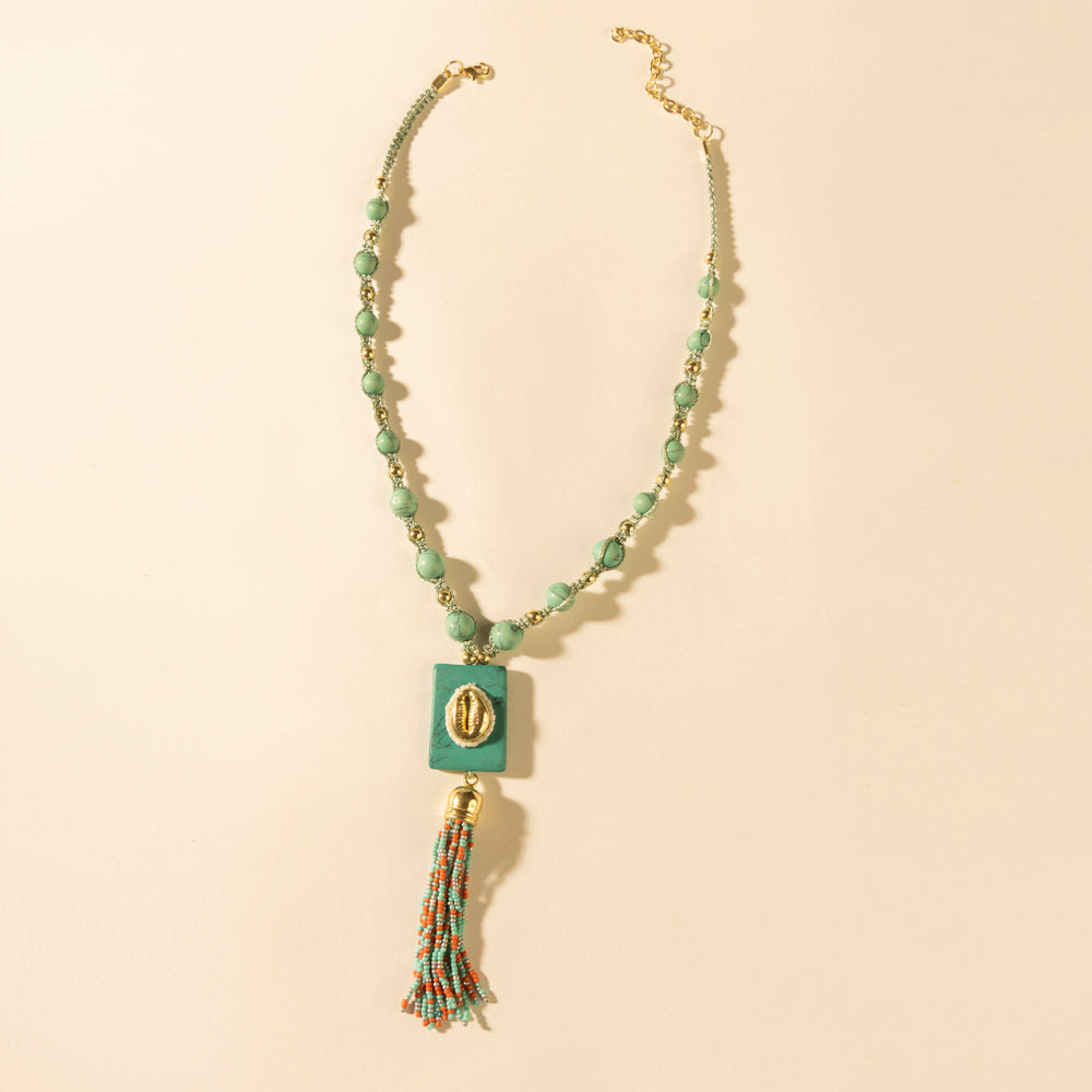 Myra Sun beaded necklace with turquoise beads, square pendant, and tassel charm