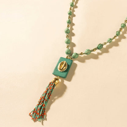 Myra Sun beaded necklace with turquoise beads and square teal pendant with tassels