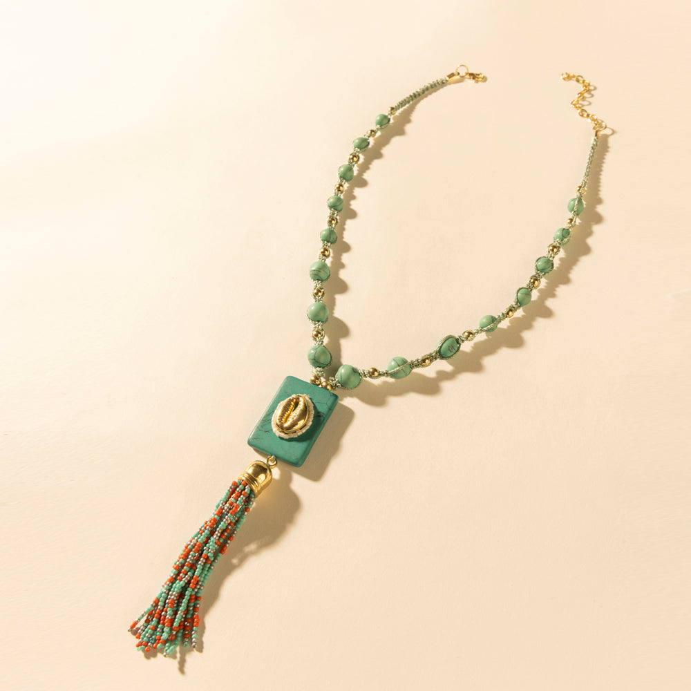Myra Sun beaded necklace with turquoise beads, teal square pendant, and gold accent