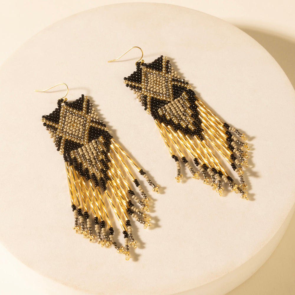 Pair of champagne beaded fringe earrings with black geometric tops and dangling beads