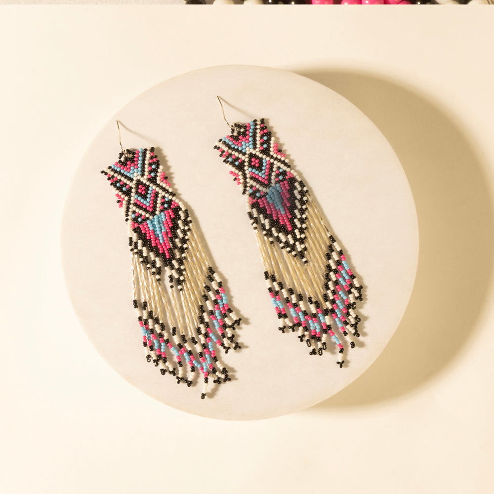 Beaded drop earrings in ivory with multicolor geometric beadwork and long fringe