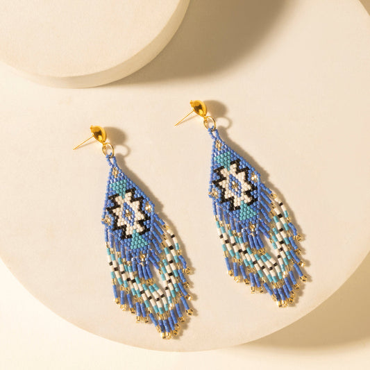 Beaded teardrop fringe earrings with cobalt blue and turquoise strands, gold hooks