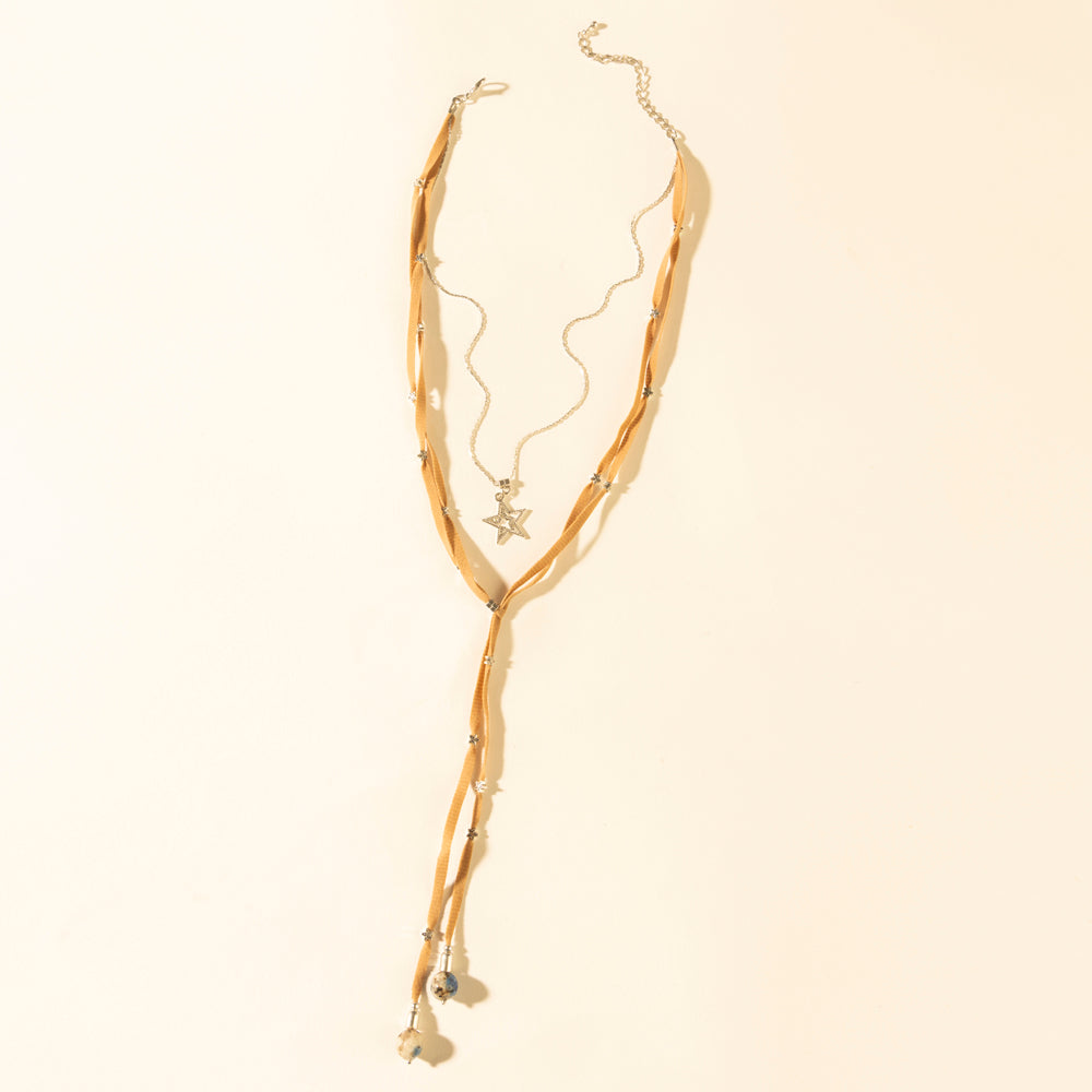 Leather necklace in saddle tan with layered strands and gold star charm