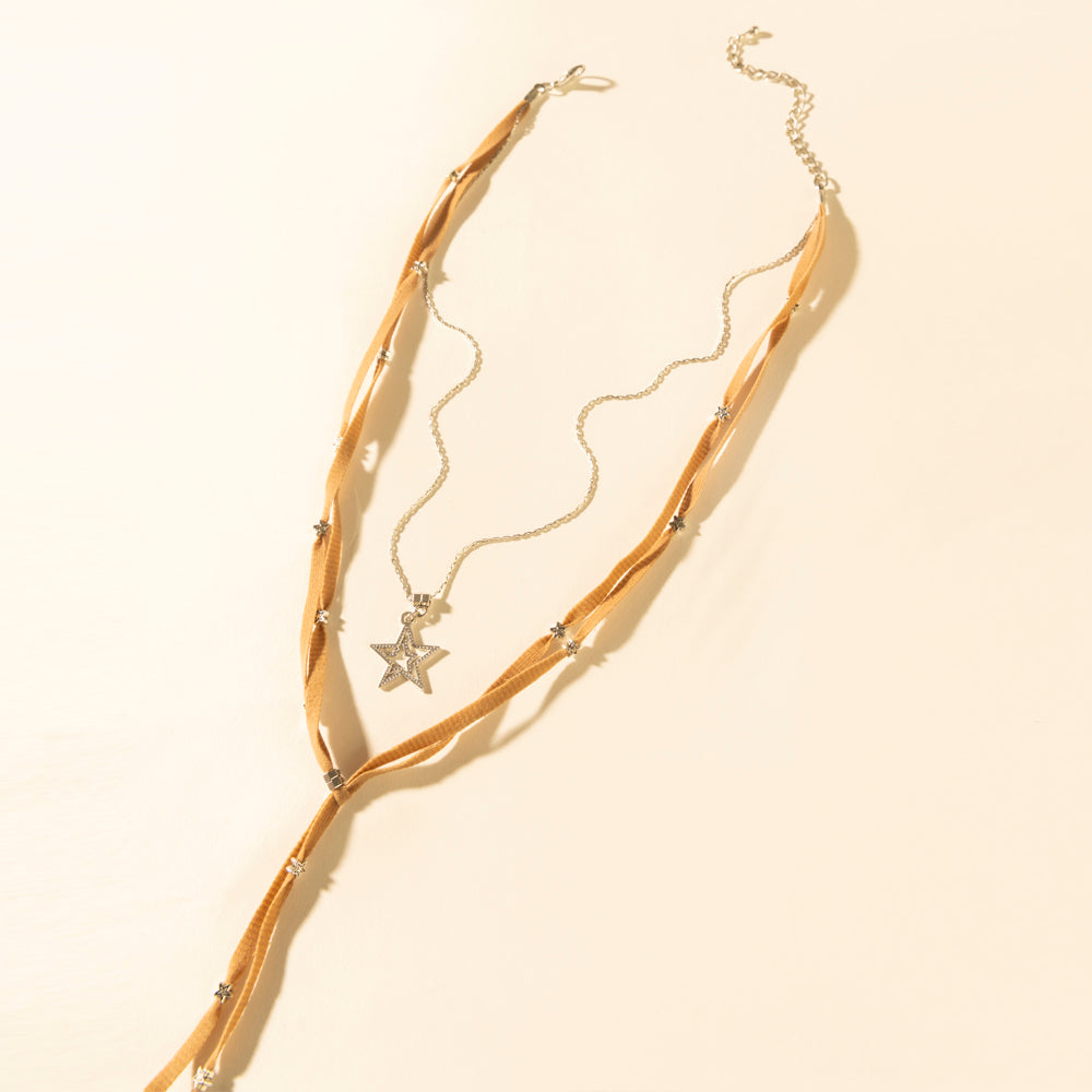 Saddle tan leather collar necklace with gold star pendant and wavy strand design