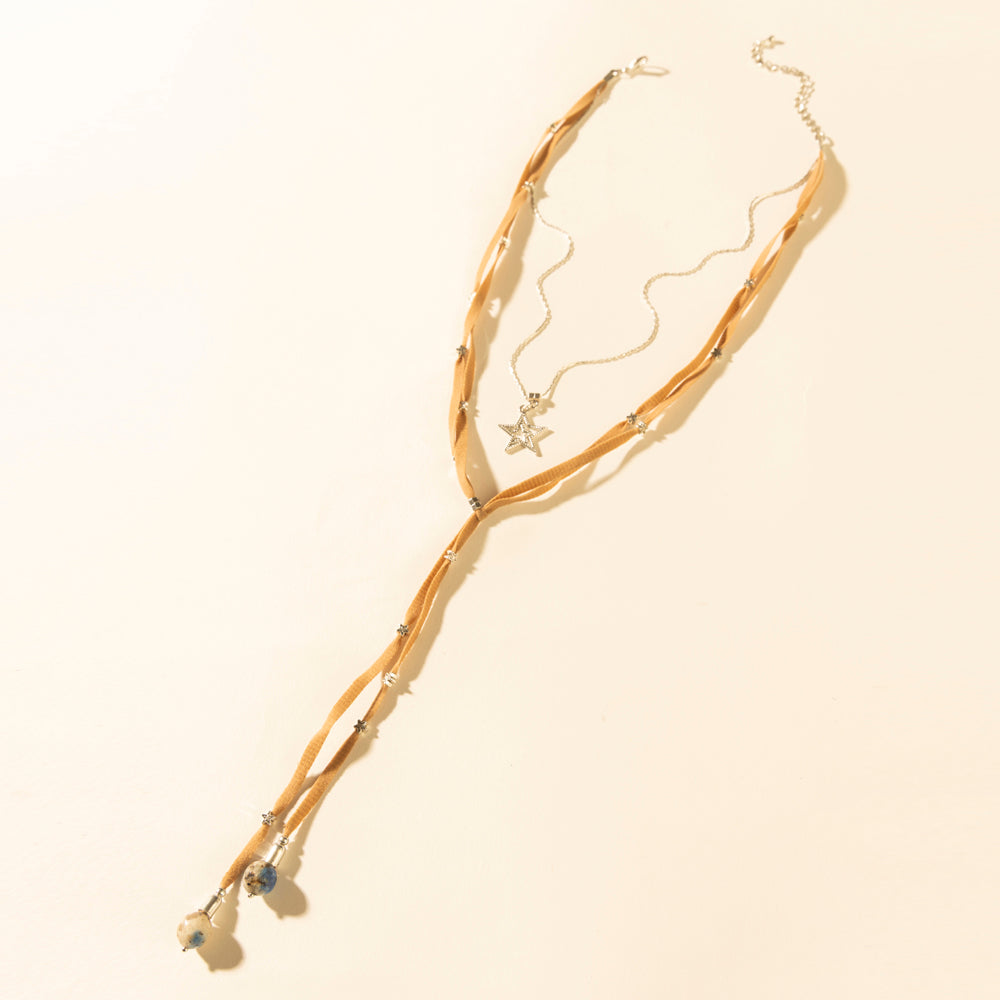 Saddle tan leather necklace with long hanging tassels and gold star charm