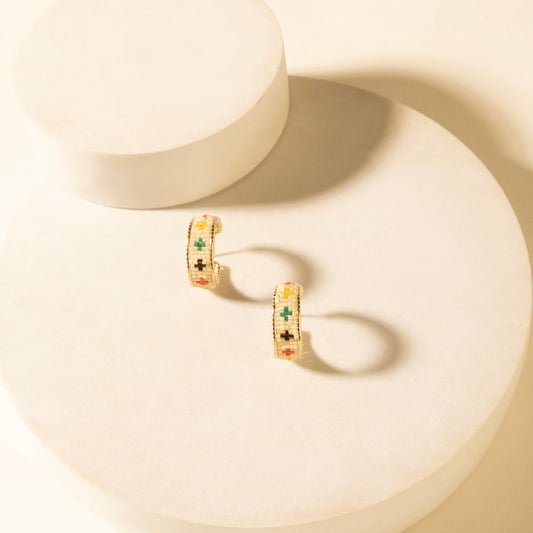 Cross-embroidered hoop earrings in desert ivory, multicolor cross detail