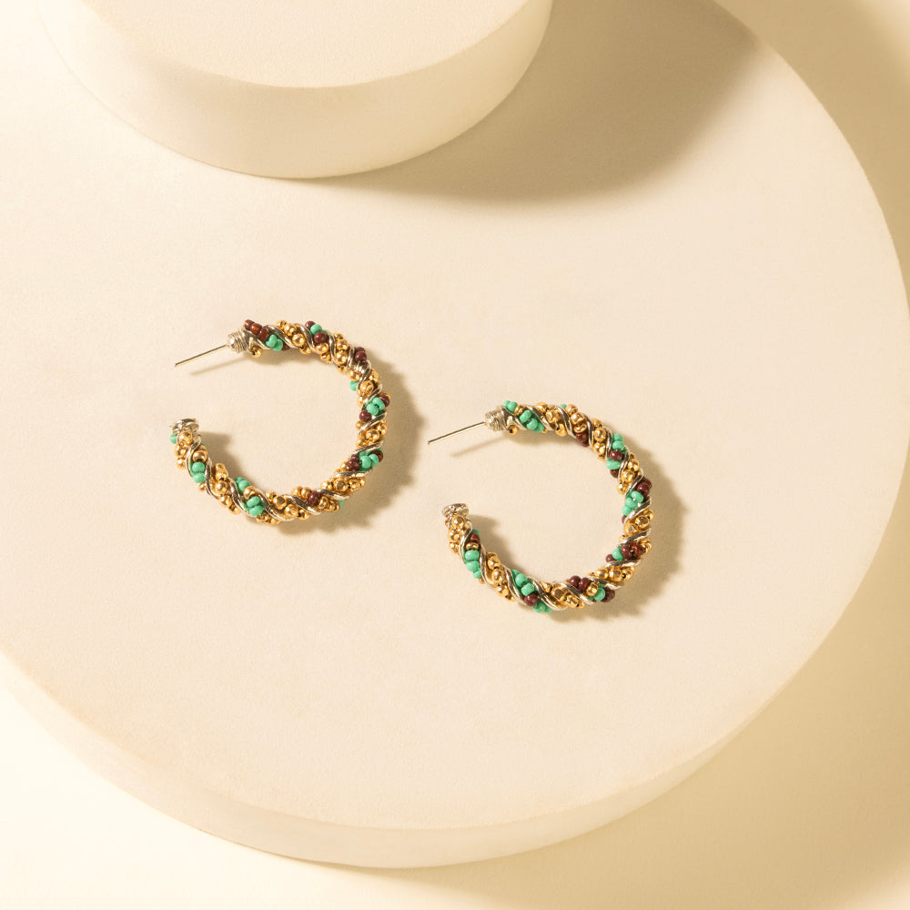 Small braided hoop earrings with turquoise bead accents, bronze-tone wire frame