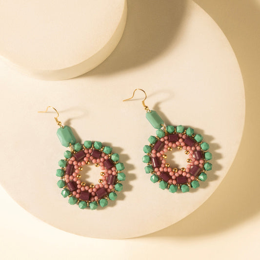 Turquoise plum beaded medallion earrings with pink and green round bead accents