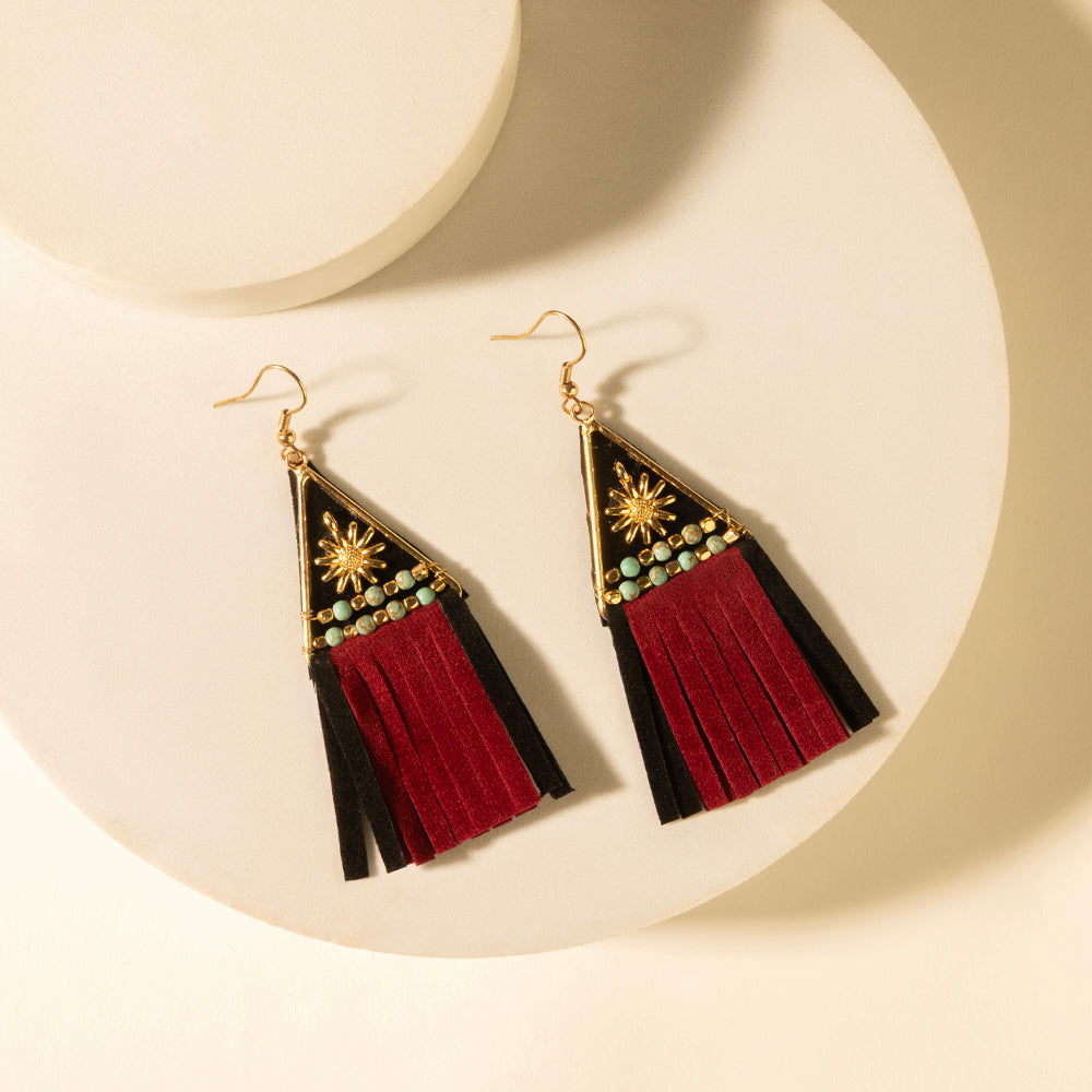 Crest tassel earrings with gold hooks, black and red fringe, beaded triangular accents