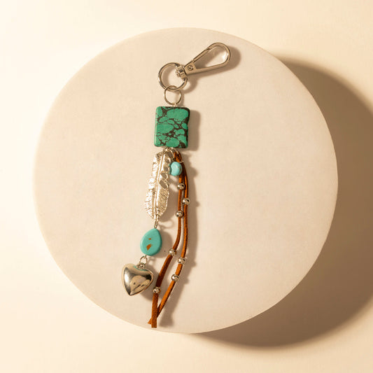 Turquoise longhorn charm keychain with green stone, heart and bell charms, metal clip