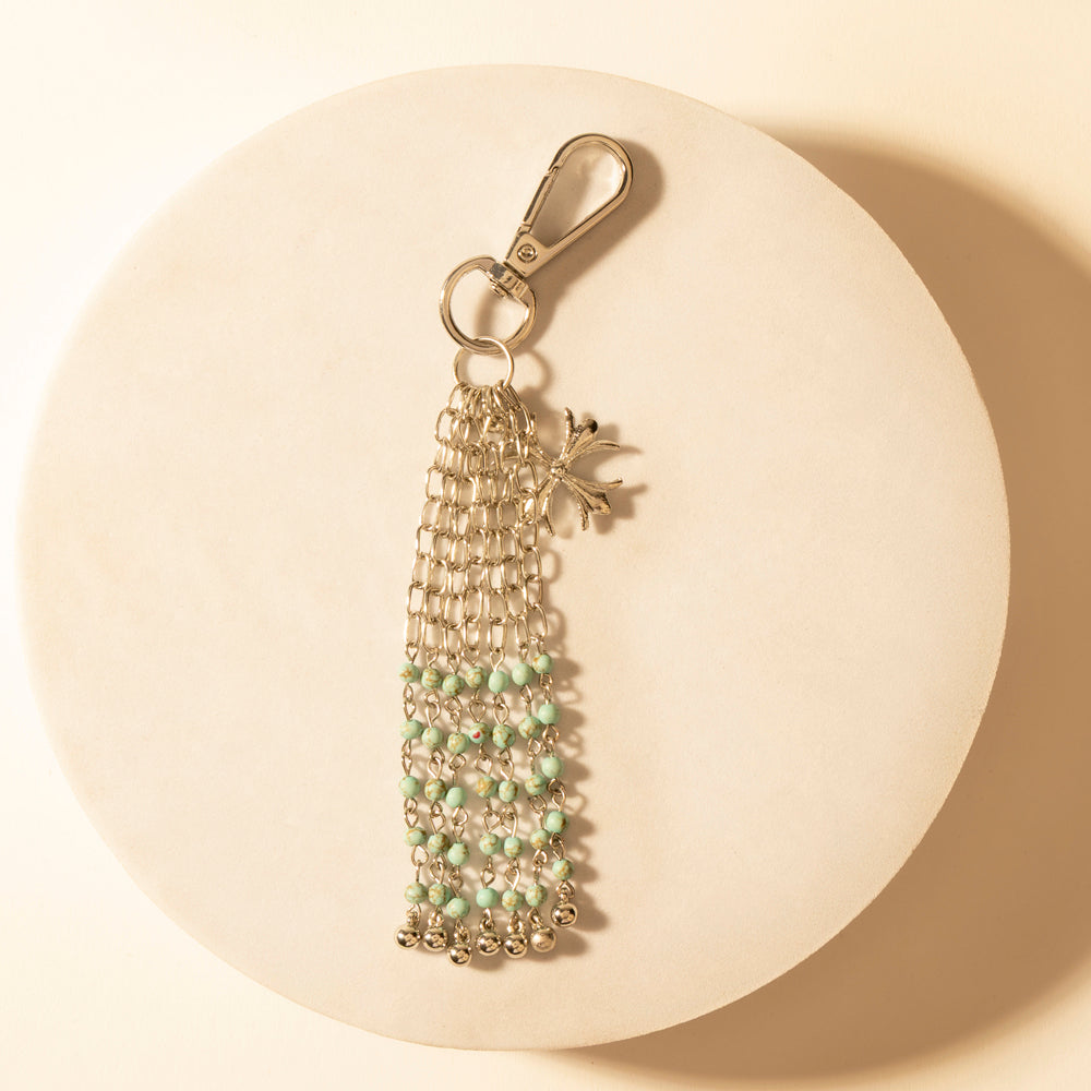 Beaded keychain with turquoise and green tassel, gold-tone ring and star charm