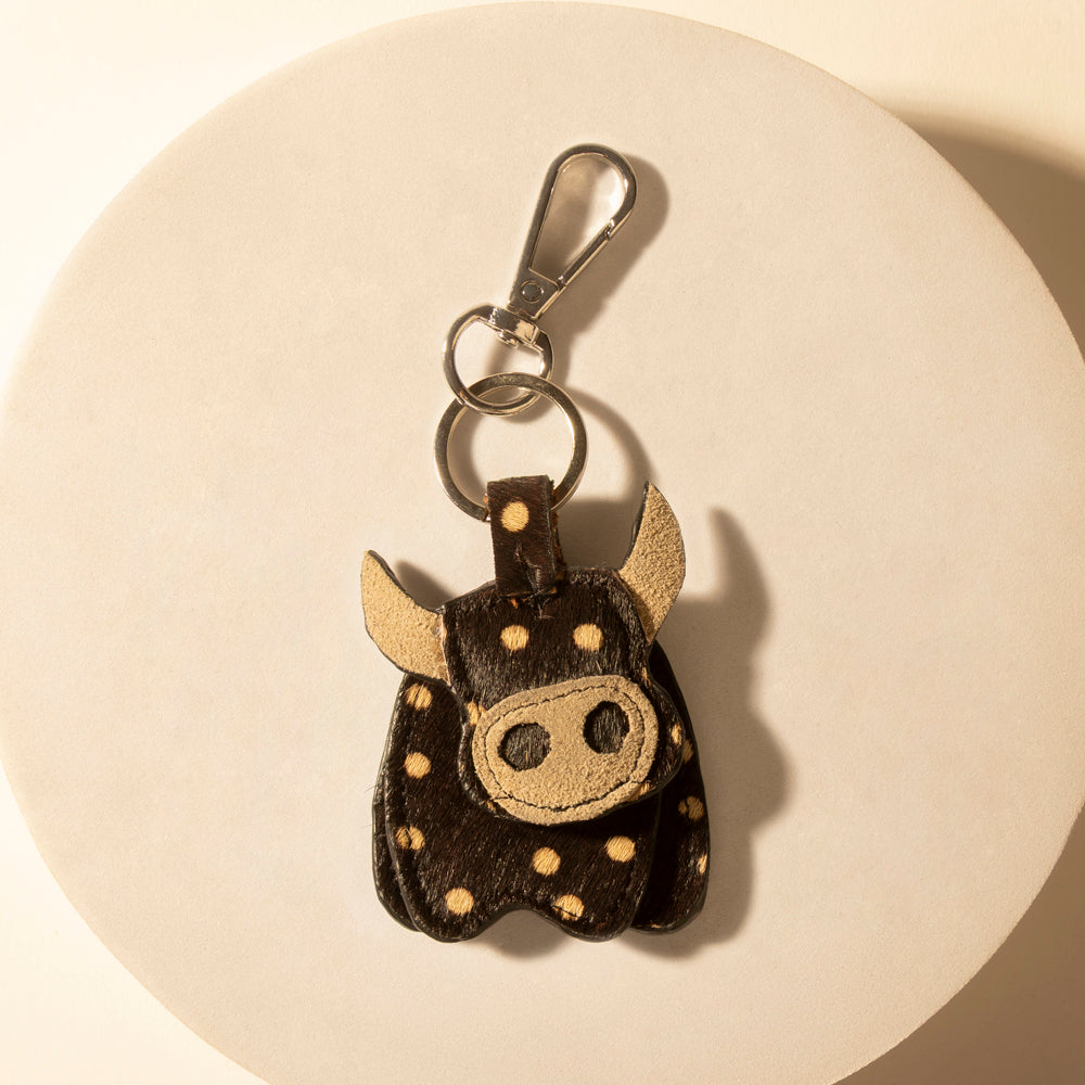 Bull keychain with brown hide face, stitched dots, and silver ring