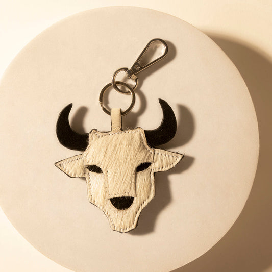 Prairie bone mix longhorn skull keychain with metal ring and clip, tan hide and black horns