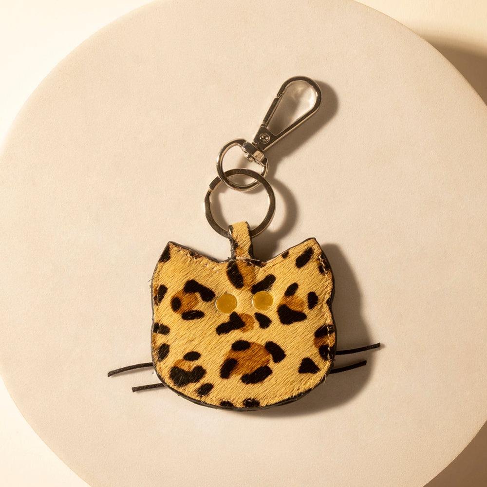 Leopard-print cat keychain with metal clip; tan with brown spots, full cat shape