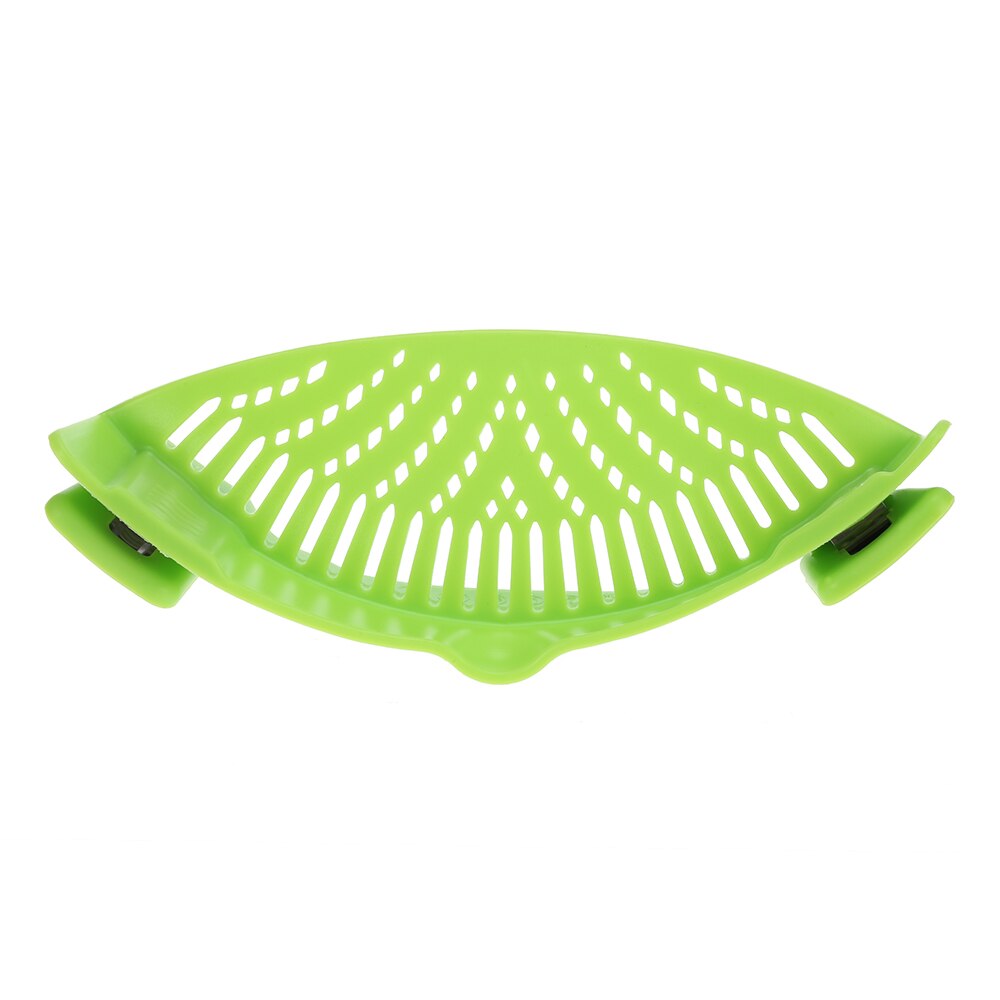 Green silicone snap strainer with curved perforation pattern and side tabs