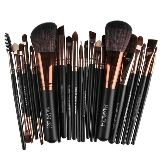 Makeup brush set with black handles and dense dark bristles, rose-gold ferrules