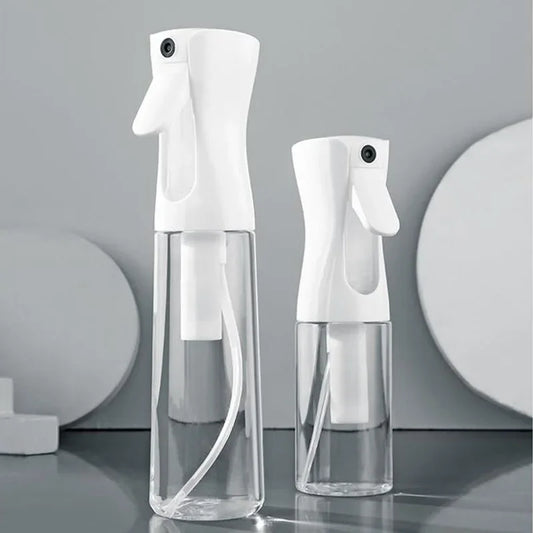 Refillable white spray bottle with trigger, clear lower reservoir, continuous mist sprayer