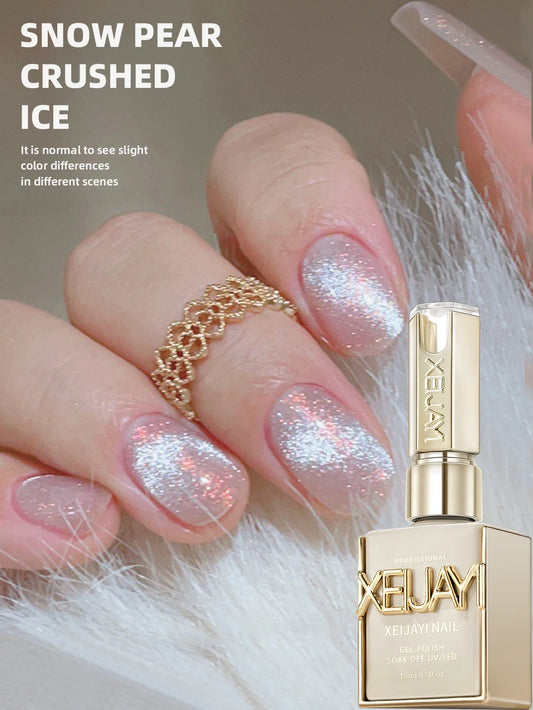 Cat eye gel nail polish in Snow Pear Crushed Ice, silver shimmer on nails with bottle