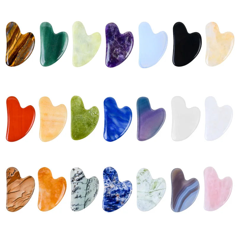 Facial gua sha stone set, assorted heart-shaped tools in black, blue, purple, and green tones