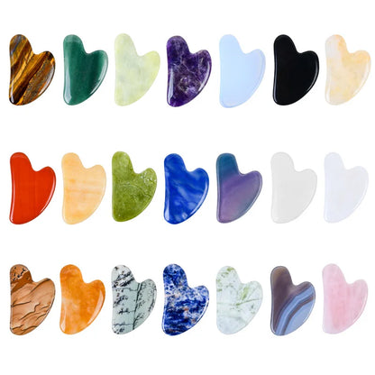 Facial gua sha stone set, assorted heart-shaped tools in black, blue, purple, and green tones