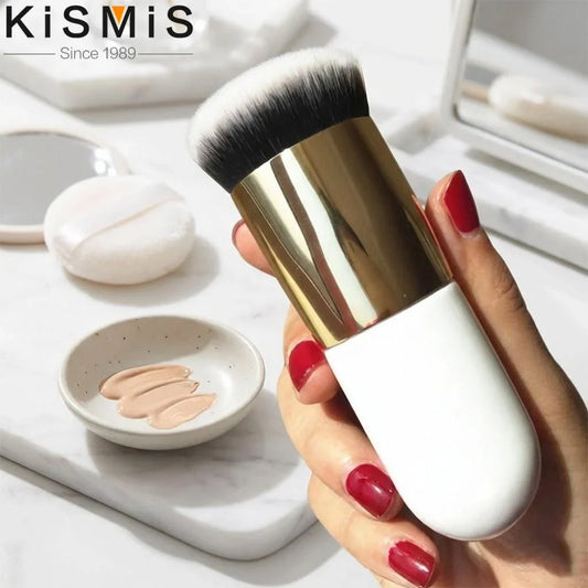 Flat foundation makeup brush with white handle, gold ferrule, and soft white bristles
