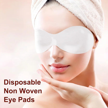 Disposable white eye pads pair on a person’s face, nonwoven skincare style