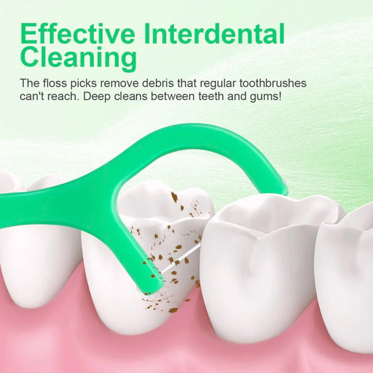 Green mint-flavored dental floss pick with ultra-fine tip cleaning between teeth