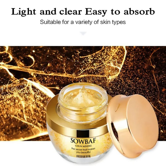 Gold face cream jar with open lid showing clear amber gel and golden serum