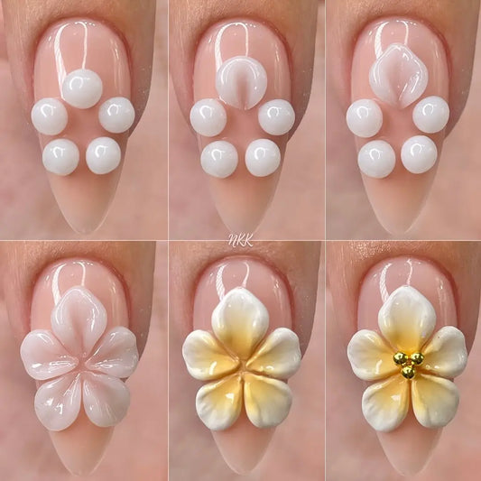 White 3D gel manicure with glossy flower dots on nude long nails
