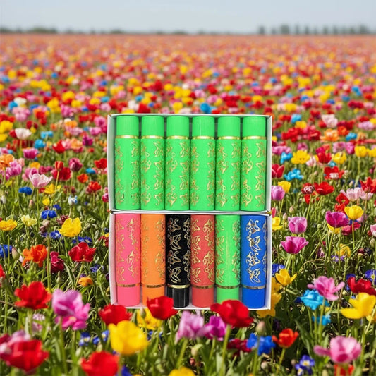 Set of 6 green gold-capped lip glosses in a gift box.