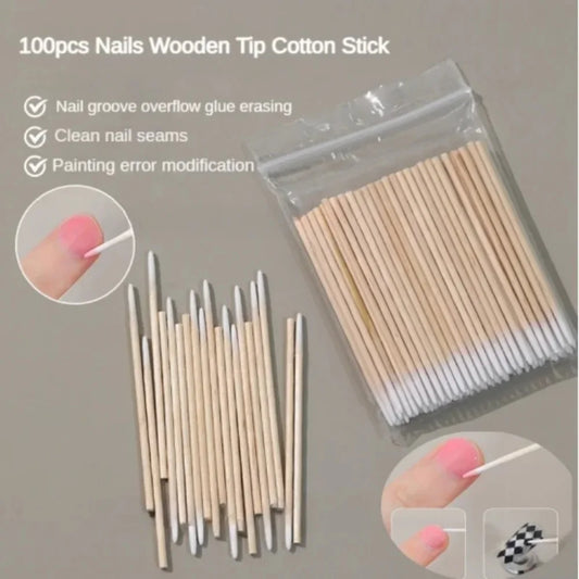 Pack of disposable wooden cotton swabs with pointed white tips for manicure correction