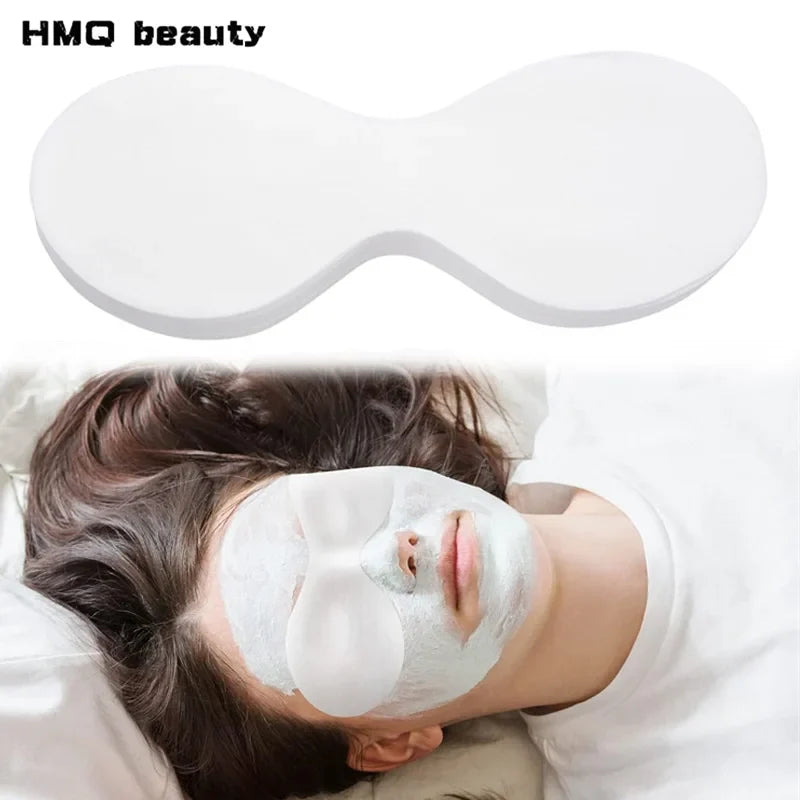 Disposable thin white eye pads placed under the eyes on a person for skincare