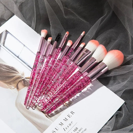 Makeup brush set with pink glitter handles and orange-tipped fluffy bristles