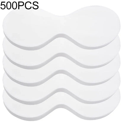 Stack of 500 disposable white eye pads, curved under-eye shape